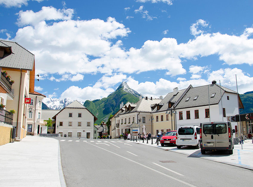 Bovec main square with the mountain Svinjak in the background